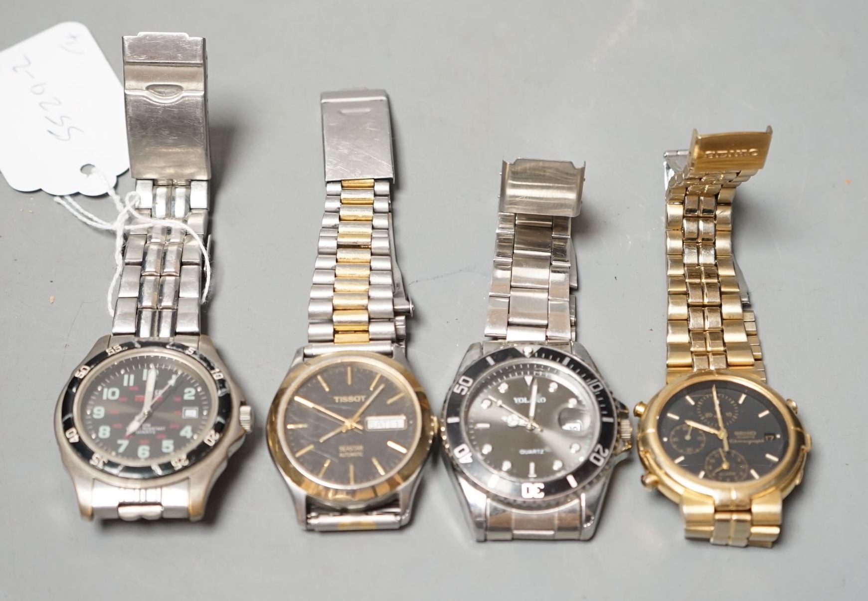 Four assorted gentleman's modern wrist watches, including Seiko and Tissot.